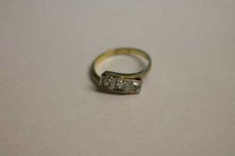 An 18ct gold three stone diamond ring.   CONDITION REPORT:  Good condition.