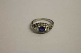 An 18ct white gold diamond and sapphire cluster ring.   CONDITION REPORT:  Good condition.