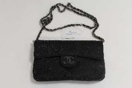 A Chanel black studded hand bag.   CONDITION REPORT:  Good condition.
