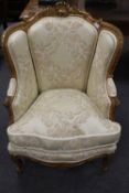 A nineteenth century giltwood  shell-backed salon chair, width 70 cm.