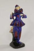 A Royal Doulton figure - The Mask, HN 656, height 16.5 cm.   CONDITION REPORT:  Sadly damaged, but
