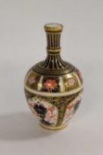 A Royal Crown Derby miniature vase decorated with Imari design 1128, height 13.5 cm.   CONDITION