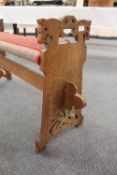 A Continental carved oak bench, width 99 cm.