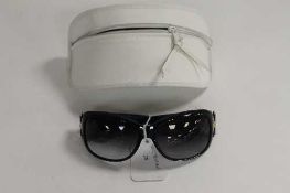 A pair of Christian Dior sunglasses, in white case with retail pouch.   CONDITION REPORT:  Good