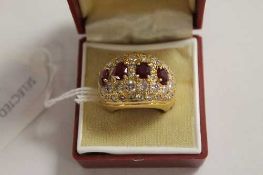 An 18ct gold four stone ruby and diamond encrusted ring, with certificate, approximately 4.5ct.