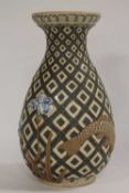 A Doulton Lambeth vase by Harry Barnard, decorated with fish design on geometric tiles, dated