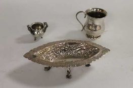 A small silver christening cup, together with a continental silver dish and miniature white metal