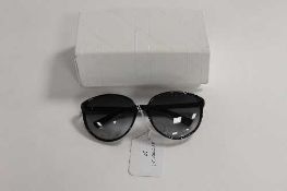 A pair of Christian Dior sunglasses, in white case.   CONDITION REPORT:  Good condition but used.