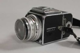 A Hasselblad 500 c/m camera, in carry case with accessories.    CONDITION REPORT:  Good condition.