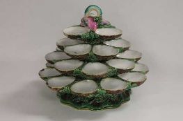 A nineteenth century majolica rotating oyster dish, height 27 cm.   CONDITION REPORT:  Possibly