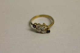 An 18ct gold diamond and sapphire six stone ring.   CONDITION REPORT:  Good condition.