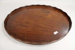 A nineteenth century inlaid mahogany oval butler's tray, width 70 cm.   CONDITION REPORT:  A small
