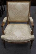 A nineteenth century giltwood armchair, width 66 cm.