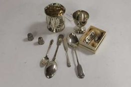 A silver egg cup, together with four items of silver cutlery, two thimbles etc. (Q)   CONDITION