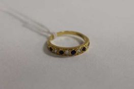 An 18ct gold diamond and sapphire ring.   CONDITION REPORT:  Good condition.