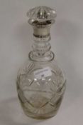 A silver topped cut-glass decanter, height 27 cm.   CONDITION REPORT:  Good condition.