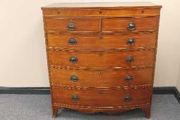 An early nineteenth century inlaid mahogany bowfronted chest of six drawers, width 120 cm.