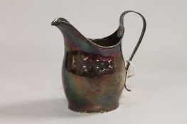 A Georgian silver cream jug of helmet form, London 1799.   CONDITION REPORT:  Good condition, with