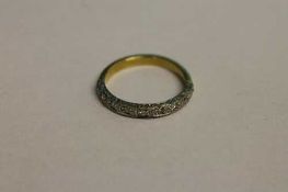 An 18ct gold diamond half eternity ring.   CONDITION REPORT:  Good condition.