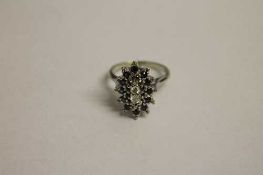 A 14ct gold diamond and sapphire cluster ring.   CONDITION REPORT:  Good condition.