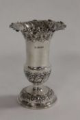 A silver embossed vase, Sheffield 1906, height 11.5 cm.   CONDITION REPORT:  Good condition, base
