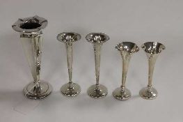 A silver fluted vase, Chester 1906, together with two small pairs of silver vases. (5)   CONDITION