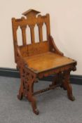 A late Victorian gothic style hall chair.   CONDITION REPORT:  Good condition.