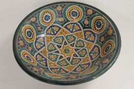 A Persian designed pottery bowl, width 31 cm.   CONDITION REPORT:  Good condition, probably early