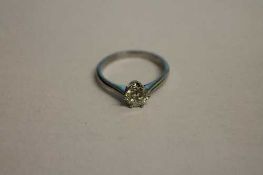 A platinum diamond solitaire ring.   CONDITION REPORT:  Good condition.
