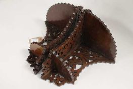 A pair of mahogany fret-work carved corner brackets. (2)   CONDITION REPORT:  Probably early