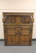 A carved oak buffet sideboard, width 122 cm.   CONDITION REPORT:  Good condition.