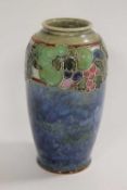 A Royal Doulton tubelined vase decorated with berries, height 24 cm.   CONDITION REPORT:  Good