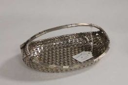 A woven silver boat shaped basket, London 1903, 168 oz.   CONDITION REPORT:  Excellent quality and