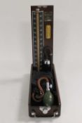 A collection of vintage medical equipment including sphygmomanometer, glass measures etc. (Q)