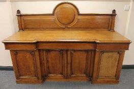 A late Victorian oak inverted-breakfronted sideboard, width 211 cm.   CONDITION REPORT:  Good