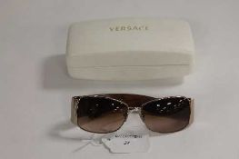 A pair of Versace sunglasses, in white case.   CONDITION REPORT:  Condition good but used.