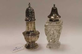 A silver sugar caster, Sheffield 1922, together with another sugar caster with silver  top. (2)