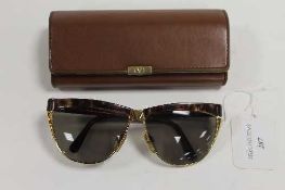A pair of Valentino sunglasses, cased.   CONDITION REPORT:  Good condition, around 15/20 years old.
