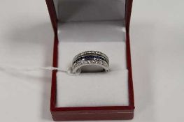 An 18ct white gold sapphire, ruby and diamond reversible ring.   CONDITION REPORT:  Good condition.