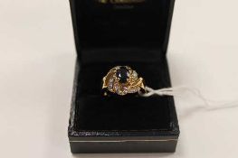 A 9ct gold sapphire and diamond ring, 6.7g.   CONDITION REPORT:  Good condition.