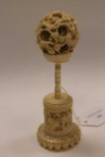 An early twentieth century ivory puzzle ball on stand, height 15 cm.   CONDITION REPORT:  Good