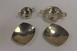 A pair of silver shallow dishes, together with a silver twin handled dish and a white metal pot