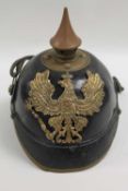 A Prussian Line Infantry Pickelhaube.   CONDITION REPORT:  Mostly good time aged condition, small