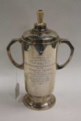 A silver trophy, Sheffield mark, date stamp 1932, with ivory finial, height 30 cm, 934 g.