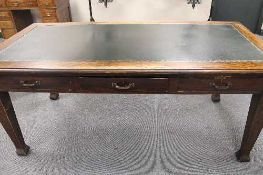 An Edwardian oak office table fitted with three drawers, length 182 cm.   CONDITION REPORT:  Good