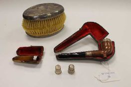 A silver mounted pipe, together with a cheroot, a pair of silver backed brushes and two silver