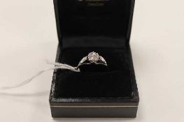An 18ct white gold diamond solitaire ring.   CONDITION REPORT:  Good condition, approximately 1/8