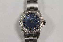A Rolex lady's stainless steel wrist watch with diamond bezel, boxed.   CONDITION REPORT:  Good