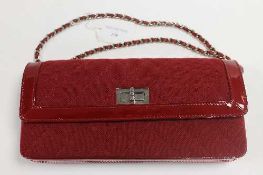 A Chanel red leather and cloth hand bag, with authenticity card no. 7023765.   CONDITION REPORT: