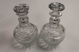 A pair of early twentieth century cut crystal decanters, height 25 cm.    CONDITION REPORT:  Good